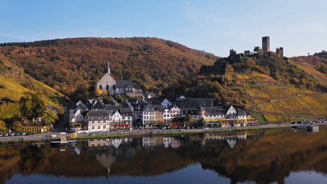 Flight over Beilstein town and autumn vineyards, Mosel valley, Germany.