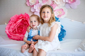 Fototapeta premium A sweet girl and her brother at home