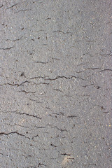 Gray cracked concrete asphalt bitumen background or texture.