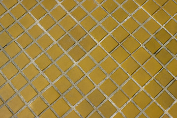 Fototapeta premium Yellow square tile floor background or texture.