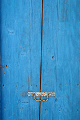 Old rustic wooden door with knob