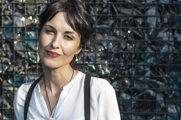Portrait of a thoughtful beautiful brunette of a feminine gender with an astute look. Young woman .
