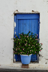 Fototapeta na wymiar Old window on old town in Malia, Greece