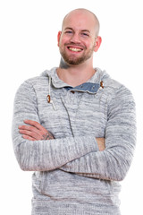 Studio shot of young bald muscular man