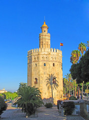 Fototapeta na wymiar The Golden Tower (Torre del Oro), built on the banks of the Guadalquivir River in the early 12th century. This extraordinary building is a model of Moorish architecture. Seville, Spain, October 2016.