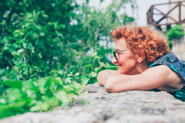 Beautiful retro older woman enjoying the view