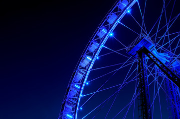 Big ferris wheel with festive blue illumination