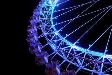 Big ferris wheel with festive blue illumination