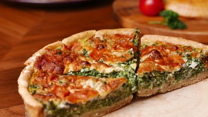 Quiche a savoury open tart or flan consisting of pastry crust with spinach mushrooms cheese. - Powered by Adobe