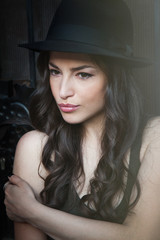 portrait of young woman with hat summer day in the city