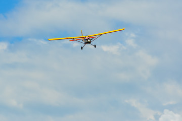 Homemade radio control aircraft  on blue sky.