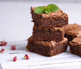 pile of square slices of baked brownie pie