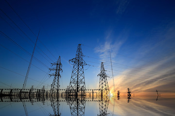 A high voltage substation in the sky at sunrise
