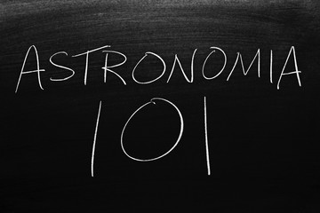 The words Astronomía 101 on a blackboard in chalk.  Translation: Astronomy 101