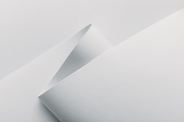 Closeup view of white rolled paper on white background