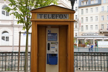Fototapeta premium Phone booth made out of wood in Carlsbad (Karlovy Vary), Czech Republic