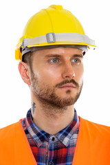 Young handsome bearded man construction worker