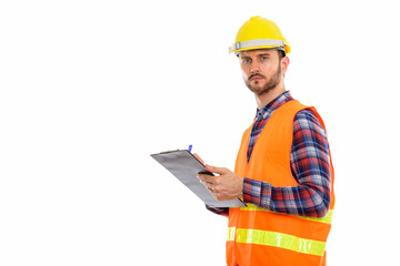 Fototapeta premium Young handsome bearded man construction worker