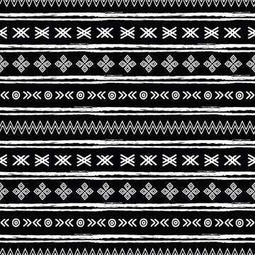 Tribal black and white seamless repeat pattern. Great for folk modern wallpaper, backgrounds, invitations, packaging design projects. Surface pattern design.