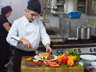 cook chef decorating garnishing prepared meal