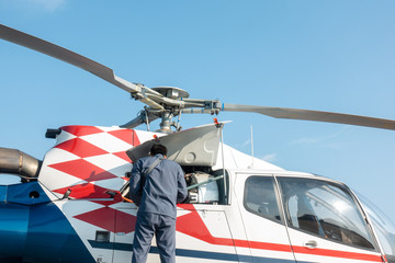 Engineer maintaining a helicopter Engine © papi8888