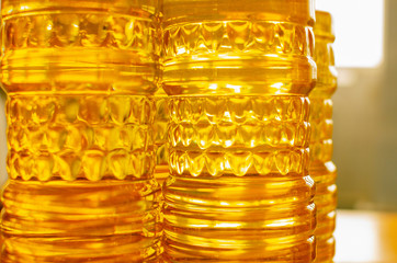 Sunflower oil. Olive oil. Bottles with butter on a wooden table.