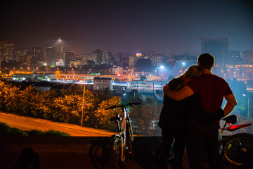Couple in love with the panorama of the night city