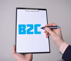 A businessman shows an inscription:B2C