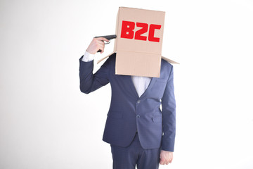 The businessman is holding a box with the inscription:B2C