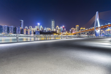 Fototapeta na wymiar Panoramic skyline and buildings with empty concrete square floor,chongqing city at night