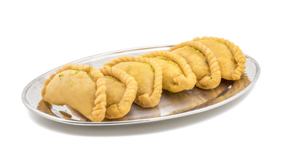 Gujiya or Gujia is a indian sweet dumpling made with suji, Maida or wheat flour and stuffed with khoya. It is common in North India, particularly in Bihar, Uttar Pradesh, Madhya Pradesh or Rajasthan