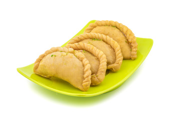 Gujiya or Gujia is a indian sweet dumpling made with suji, Maida or wheat flour and stuffed with khoya. It is common in North India, particularly in Bihar, Uttar Pradesh, Madhya Pradesh or Rajasthan