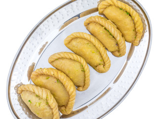 Gujiya or Gujia is a indian sweet dumpling made with suji, Maida or wheat flour and stuffed with khoya. It is common in North India, particularly in Bihar, Uttar Pradesh, Madhya Pradesh or Rajasthan