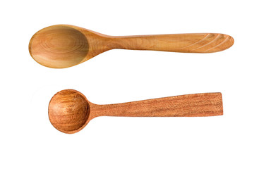 Small spoons of natural light brown wood, isolated on white background, close-up