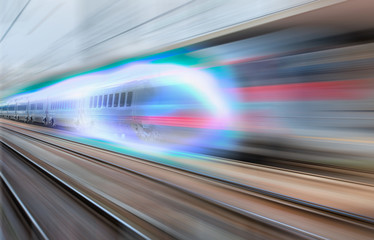 Obraz na płótnie Canvas White high speed train runs on rail tracks . Train in motion.