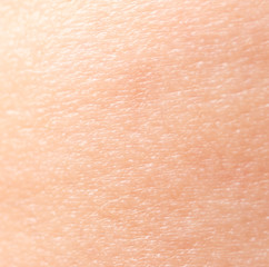 The skin of a young man as a background