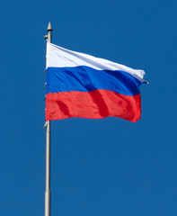 Flag of the Russian Federation against the blue sky