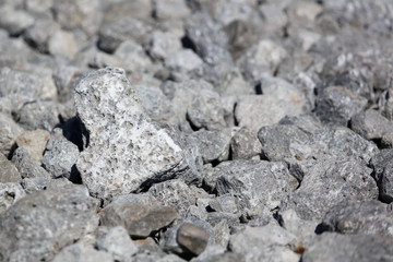 Stone crushed stone on the construction site as an abstract background