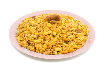 Indian Delicious And Crunchy Mix Namkeen Food Also Know As Mixture, Chivda, Farsan, Namkin, Nimco or Nimko Made of Gram Flour And Mixed With Dry Fruits isolated on White Background