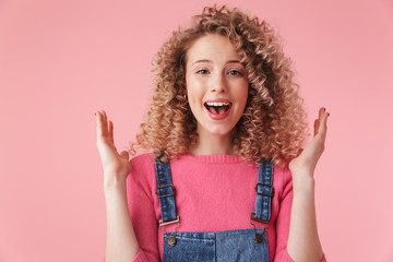 Close up portrait of smiling young girl with curly hair