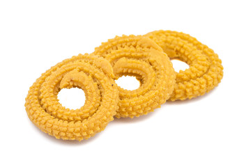 Indian Traditional Deep Fried Snack Chakli Also Called Chakali, Chakri, Murukku, Muruku, Murkoo isolated on White Background