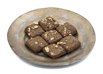Special Traditional Fresh And Sweet Baked Chocolate Chip Cookies or Biscuits and Nan Khatai Served in Plate isolated on White Background