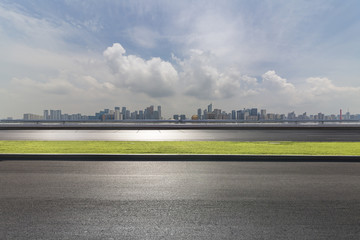 Panoramic skyline and buildings with empty road