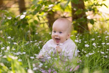 Beautiful infant baby girl portrait  in nature