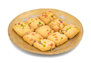 Delicious Tutti Frutti Cookies or Biscuits in Vintage Plate Also Know as Candied Fruits Cookies isolated on White Background