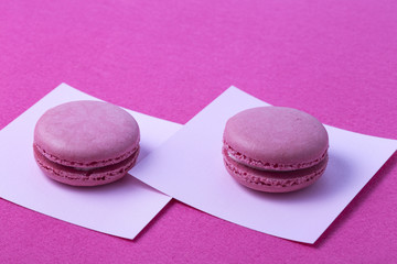 Sweet colorful macarons isolated on white background.