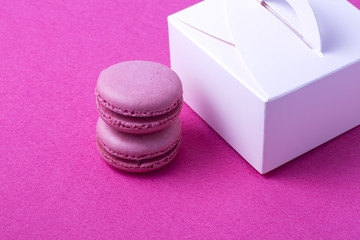Sweet colorful macarons isolated on white background.
