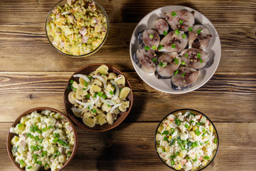 Various festive dishes on wooden table