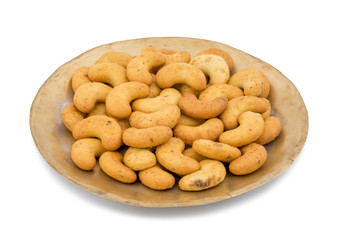 Salted Flavor Roasted Cashew Nut Snacks Served in Plate Also Know as in India Kaju Namkeen or Masala Kaju isolated on White Background