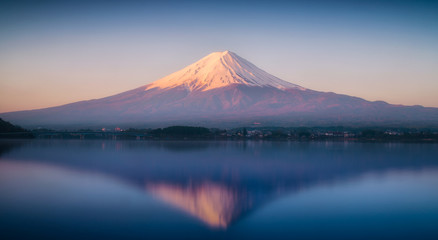 Fototapeta premium Mount Fuji in the early morning with reflection on the lake kawaguchiko